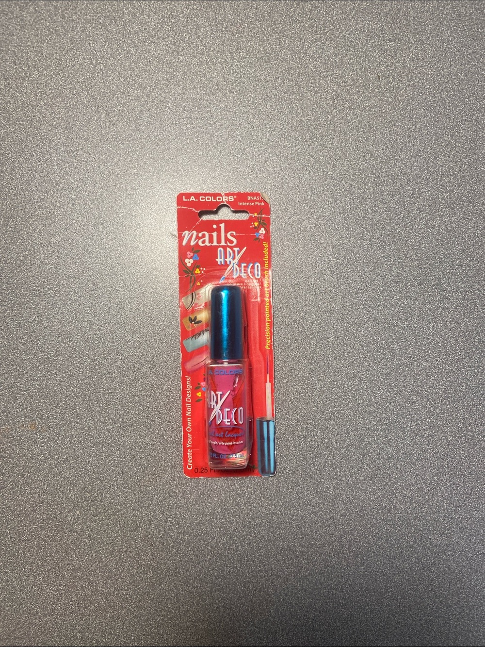 L.A. Colors Art Deco Nail Lacquer in Bright Pink with Metallic Blue Cap